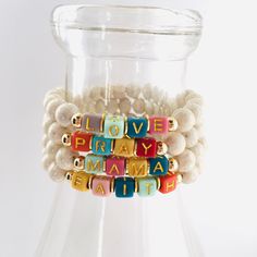 This listing is for a 8mm creamy white river stone bead stretch bracelet with colorful acrylic cube letter beads and accented with 14k gold filled tarnish resistant spacer beads - your choice of any word, name, or initials. Bracelets are strung on high quality stretch cord and will be made in an average 7 inch size that will fit most wrists. If unsure about sizing, please see measuring instructions below: MEASURING INSTRUCTIONS FOR AN ACCURATE FIT: Wrap your wrist snugly with a string and then m Alphabet Letter Bracelet, Trendy Birthday Stretch Bracelet With Letter Beads, Friendship Letter Beads Stretch Bangle Bracelet, Gift Stretch Bracelet With Letter Beads, Themed Multicolor Stretch Bracelet With Letter Beads, Colorful Stretch Bracelet With Letter Beads, Letter Bracelet Beads, Daycare Teacher Gifts, Letter Bead Bracelets