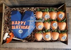 a box filled with chocolate covered strawberries in the shape of heart shaped carrots