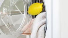 a yellow lemon sitting on top of a dryer