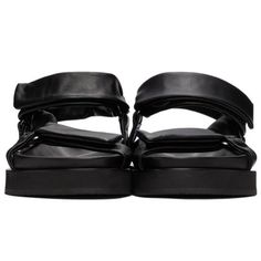 Jill Sander Black Sheepskin Sandals. Grained Nappa Sheepskin Sandals In Black. Butter Soft, Luxurious Leather. Open Round Toe. Adjustable Velcro Straps At Vamp And Ankle. Textile Logo Patch At Tonal Molded Leather Footbed. Tonal Treaded Rubber Sole. Silver-Tone Hardware. Evening Double Strap Leather Sandals, Black Calf Leather Sandals With Ankle Strap, Designer Double Strap Leather Sandals, Black Leather Sandals With Heel Loop, Leather Sandals With Padded Heel And Double Strap, Leather Double Strap Sandals With Padded Heel, Double Strap Leather Sandals With Padded Heel, Black Calf Leather Sandals With Leather Footbed, Black Calf Leather Sandals For Spring