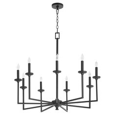 a black chandelier with eight candles hanging from it