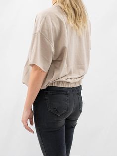 Oversized, but slightly fit in this Cinched Waist Tee. It features a loose short sleeve fit, round neck, and a cinched elastic waist. SIZE & FIT Fit is true to size Model is 5'6" wearing size small Trendy Slouchy Tops For Everyday, Casual Slouchy Tops For Loungewear, Casual Cotton Slouchy Tops, Slouchy Casual Cotton Tops, Slouchy Short Sleeve Tops For Loungewear, Casual Slouchy Top For Summer, Casual Batwing Sleeve Tops For Loungewear, Slouchy Relaxed Crew Neck Tops, Casual Batwing Sleeve Loungewear Tops