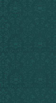 a dark green wallpaper with an ornate design on it's side and the bottom corner