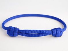 a blue rope with two ends on a white background