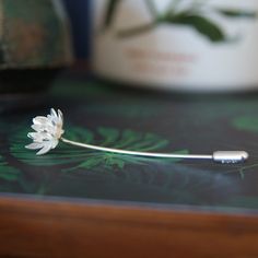 Lotus Flower Brooch Pin Flower - 16mm diameter Stick Pin is sterling silver 1.2mm wire approx 6cm long. Fastened with a simple, silver push-on stopper. With a bright matt-white silver finish & polished highlights. This pin can be worn on a lapel, tie, scarf or hat. Bear in mind the pin may leave a small hole on the garment. Handmade by me, in Wales, UK. Packaged in a gift-box and ready to give as a present. Matching pieces available : https://www.etsy.com/uk/listing/616340051 Did you know? -The Lotus Flower Jewelry, Lotus Necklace, Lotus Earrings, Wales Uk, Tie Scarf, Rose Jewelry, Jewellery Handmade, Yoga Jewelry, Flower Accessories