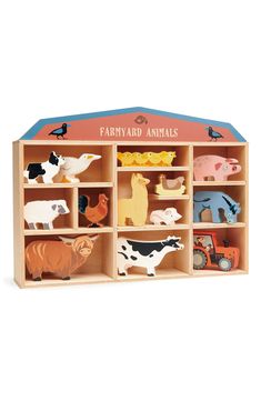 a wooden toy farm animal set in a storage unit with doors open to reveal it's contents