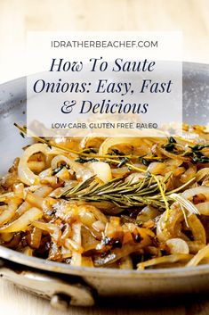 a pan filled with onions and herbs on top of a wooden table