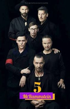 the band u2 posing for a portrait in black