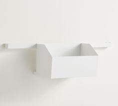 an empty white box hanging on the wall