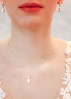 "Classic bridal necklace with a Swarovski nacre pearl drop and crystal pendant on a fine sterling silver chain. To be worn with matching Ines bracelet and backdrop and Anna earrings.   - Length: 41cm (16\") + 4 cm (1.5\") extension chain - Length of pendant: 2cm (0.78\") - Sterling silver chain and clasp If you require a special size, please contact me. We accept returns and exchanges even for special sizes. ♥ Ines collection https://www.etsy.com/fr/shop/Princessed1jour?ref=l2-shopheader-name&search_query=ines ♥ Anna collection https://www.etsy.com/fr/shop/Princessed1jour?ref=l2-shopheader-name&search_query=anna ♥ All bridal necklaces https://www.etsy.com/fr/shop/Princessed1jour?section_id=23004653 ♥ My shop https://www.etsy.com/fr/shop/Princessed1jour" Silver Graceful Jewelry With Pearl Charm, Delicate Silver Pearl Necklace With Charm, Delicate Silver Pearl Drop Necklace, Teardrop Cubic Zirconia Jewelry With Pearl Charm, Teardrop Pearl Charm Jewelry With Cubic Zirconia, White Cubic Zirconia Necklace With Pearl Charm, Elegant White Gold Drop Necklace For Wedding, Delicate Silver Pearl Pendant Necklace, Elegant Silver Bridal Necklace With Pearl Charm