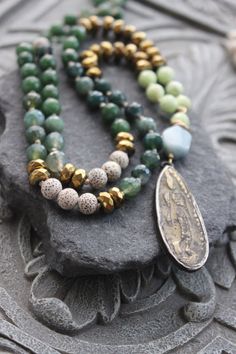 Green Jade Long Knotted Necklace with tribal buddha pendant - Gemstone long talisman necklace, gift for her Gold Jewelry With Hand-knotted Round Beads, Spiritual Gold Jade Beaded Necklaces, Spiritual Gold Jade Beaded Necklace, Jade Jewelry With Natural Stones For Meditation, Spiritual Bronze Round Beads Jewelry, Jade Gemstone Beads Jewelry For Meditation, Spiritual Jade Jewelry With 108 Beads, Spiritual Bronze Agate Jewelry, Beaded Amulet Jewelry For Meditation