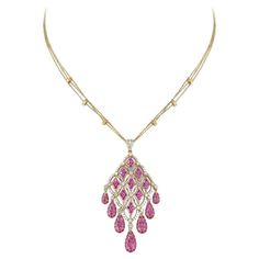 Pendant in 18kt yellow gold set with 110 diamonds 1.45 cts and 137 rubies 6.24 cts Luxury Yellow Gold Briolette Diamond Necklace, Luxury Pink Ruby Necklaces, Luxury Pink Diamond Necklace, Luxury Ruby Diamond Necklace With Diamond Accents, Luxury Ruby Diamond Necklace With Accents, Luxury Ruby Necklace In Yellow Gold, Luxury Yellow Gold Ruby Necklace, Ruby Diamond Pendant, Ruby Pendant Necklace