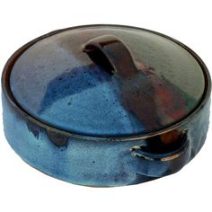 a blue and brown pot with handles on it's side, sitting in front of a white background