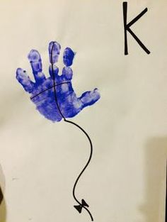 a child's handprint with the letter k on it, and an arrow