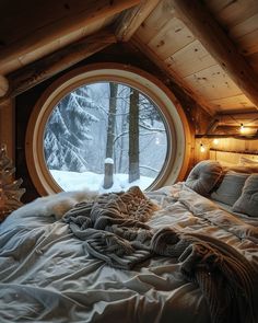 a bedroom with a large round window in it