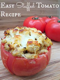 an easy stuffed tomato recipe in a red bowl on a wooden cutting board with tomatoes