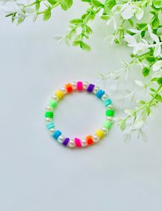 This bracelet is very cute and colorful Trendy Multicolor Stretch Bracelet For Gift, Trendy Multicolor Stretch Bracelet As Gift, Multicolor Round Beads Pearl Friendship Bracelet, Cute Multicolor Round Beaded Bracelets, Playful Colorful Bracelets For Friendship, Trendy Colorful Bracelets For Gifts, Trendy Colorful Bracelets As Gifts, Trendy Handmade Multicolor Stretch Bracelet, Trendy Multicolor Handmade Stretch Bracelet