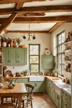 a kitchen filled with lots of green cabinets and counter top next to a white sink