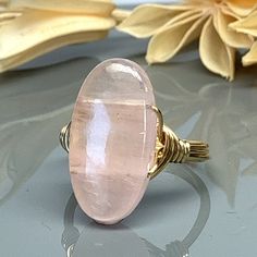 Rose Quartz Oval Statement Ring-Sterling Silver, 14k Yellow or Rose Gold Filled Wire Wrapped Ring -Custom Size (full, .25, .5, .75) by SimplyCharmed21 on Etsy Handmade Oval Rose Gold Rings, Spiritual Oval Rose Gold Jewelry, Oval Pink Gold Promise Ring, Pink Oval Spiritual Ring, Oval Wire Wrapped Rings For Gifts, Oval Wire Wrapped Rings As Gifts, Adjustable Oval Pink Jewelry, Adjustable Pink Oval Jewelry, Pink Adjustable Oval Jewelry