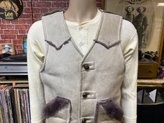 "Cool Schott N.Y. Sportswear sherpa western leather vest on size Medium. Two pockets, sherpa lining, good used condition, some wear and marks, small snag on the back, check pictures. Made in U.S.A.  Please check the measurements before purchase, we do not accept returns or exchanges.   Measurements lying face down: 20 1/2\" Across chest underarm to underarm. 16\" Shoulder seam to seam. 23\" Long, straight down from base of the back collar/neck to bottom hem. 25\" Long, straight down from the top of the shoulder to bottom hem. Let me know if you have any questions or would like to see additional photos. International buyers: Please ask for the shipping rates speciality for your country." Fitted Western Style Winter Vest, Fitted Western Vest For Winter, Western Style Vest With Pockets For Fall, Sleeveless Western Winter Outerwear, Collar Neck, Western Leather, Face Down, Vest Outfits, Leather Vest