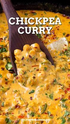 chicken curry in a skillet with a wooden spoon on the side and text overlay