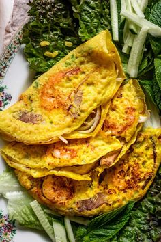 an omelet with meat and vegetables on a plate