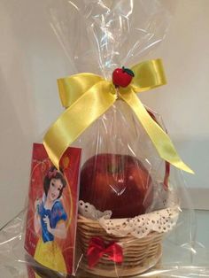 a basket filled with an apple next to a card