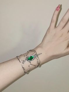 Elven bracelet made with aluminum wire and emerald green crystal. Elven Style Metal Jewelry For Gifts, Elven Style Metal Jewelry Gift, Adjustable Elven Style Metal Jewelry, Elven Bracelet, Emerald Green Crystal, Forest Elf, Green Crystal, Green Crystals, Bracelet Making