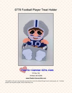 a crocheted stuffed animal in a football uniform