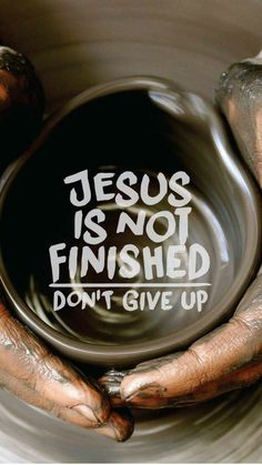 an image of someones hands holding a bowl with the words jesus is not finished don't give up