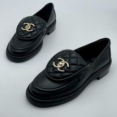 Chanel 2022 Rev Collection Lambskin Leather Slip On Loafers Feature A Quilted Foldover Tab Front And Goldtone Turnlock Cc Logo At Vamp. 1" Stacked Heel. Padded Leather Insole And Leather Sole. Designer Color: Black. Made In Italy. Size: 36.5 Eu (Insole Measures: Approx. 9.25") Typically Chanel Footwear Runs Small. Brand New In The Original Chanel Box. Chanel Turnlock Loafers, Luxury Slip-on Platform Loafers For Formal Occasions, Luxury Black Slip-on Moccasins, Luxury Business Platform Loafers With Rubber Sole, Luxury Black Loafers With Rubber Sole, Luxury Black Loafers With Round Toe, Luxury Slip-on Black Leather Shoes, Luxury Black Slip-on Loafers, Luxury Black Slip-on Leather Shoes