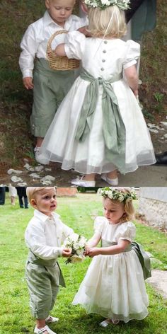 two young children dressed in white and green outfits, one is holding the other's hand