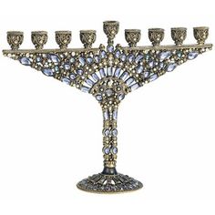 an elaborately decorated menorah with eight candles