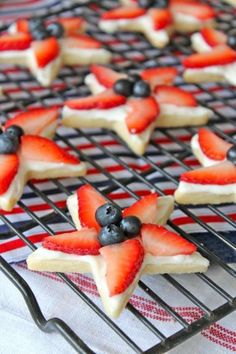 red, white and blue desserts are cooling on a wire rack with an american flag design