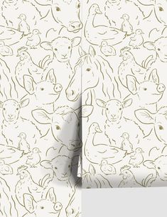 the wall paper has animals drawn on it