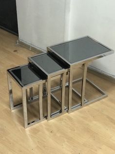 three tables sitting on top of a hard wood floor