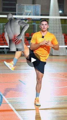 a man in an orange shirt and black shorts kicking a volleyball ball on a court