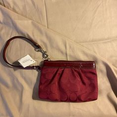 Nwt Coach Signature Patent Leather And Fabric Wristlet Color Is Crimson New With Tags And Coach Card Inside Standard Wristlet With Zipper Closure 1 Interior Pocket Retails $140 Clutch Wristlet With Zipper Closure, Coach Red Wristlet With Zipper Pouch, Coach Red Wristlet With Zipper Closure, Red Coach Wristlet With Zipper Closure, Red Coach Wristlet For Everyday Use, Coach Red Wristlet With Wrist Strap, Red Coach Wristlet With Wrist Strap, Elegant Red Wristlet With Zipper Pouch, Red Clutch Wristlet With Zipper