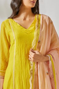 Yellow kurta with lace detail. Paired with lace detailed palazzo and embroidered dupatta.
Components:3
Embroidered
Neckline:V neck
Sleeve Length:Three quarter
Fabric:Viscose Cotton Silk, Chanderi
Color:Yellow
Lace border
Floral motifs - Aza Fashions Kurta Set For Women, Chanderi Suits, Embroidered Neckline, Yellow Lace, Evening Outfits, Lace Border, Silk Pants, Yellow Fabric, Kurta Set