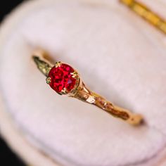 Introducing our elegant Magnolia ring solitaire. We offer this as made to order with a selection of 22 gemstones which can be found here (shown is an example of 14K yellow gold with lab-grown ruby; the pictured ring is sold). Four double-prongs clasp a smaller 4mm round brilliant cut lab-grown ruby. This ring can be customized with diamonds set into the band (not pictured, please see our 22-gemstone made to order Magnolia ring listing for examples of side diamonds). -- Custom?: We can create you Red Solitaire Birthstone Ring, Ruby Solitaire Birthstone Ring With Round Stone, Red Solitaire Birthstone Ring With Round Band, Promise Ruby Ring With Prong Setting, Ruby Solitaire Birthstone Ring In Round Cut, Solitaire Ruby Birthstone Ring, Red Sapphire Birthstone Ring In 14k Gold, Ruby Solitaire Birthstone Ring With Round Cut, Ruby Solitaire Birthstone Ring For Promise