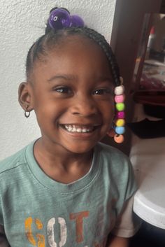 This fun cornrow hairstyle has braids that go straight back and are stay-put and great for energetic kids. The braids have bright beads on the ends, adding a fun part that kids like. The hairstyle not only looks cute but also helps keep hair neat and out of the face, perfect for school time and playing outside. - Click to see more of 20 Cute and Stylish Cornrow Hairstyles for Kids and follow us for more hairstyle ideas. // Photo Credit: Instagram @neenee_styld Playing Outside, Straight Back