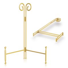 a pair of gold plated metal stands with two hooks on each side and one hook at the top