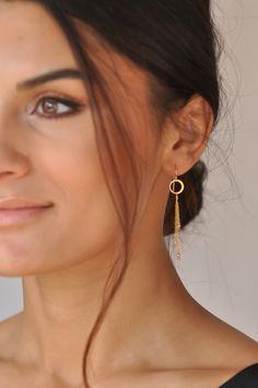 "These playful chain tassel earrings will make you stand out instantly. Four chains adorned with gold beads dangle from tiny hoops. Light weight and ultra comfortable. Sleek, sophisticated and a little flirty. Our gift to you 10% off your first purchase. Details here - http://eepurl.com/dpVPBz DETAILS Total earring length including ear wire is 2.5\" 14 k gold fill or sterling silver ear wires, chain and beads 24 k gold plate circles These earrings are sold as a pair All earrings are not returnab Delicate Dangle Linear Earrings With Chain, Delicate Dangle Linear Earrings, Delicate Dangle Linear Earrings With Adjustable Chain, Dainty Drop Earrings With Delicate Chain, Dainty Yellow Gold Linear Dangle Earrings, Gold Dangle Tassel Earrings For Wedding, Gold-plated Delicate Chain Earrings, Chandelier Earrings With Adjustable Chain As Gift, Delicate Gold-plated Chain Earrings