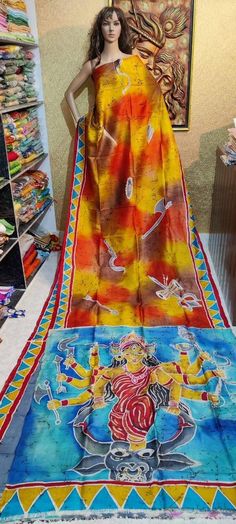 This design based on the Traditional Maa durga drawing art work mix batik work over the saree. With maa durga abstract drawing work Feel the Original Murshidabadi/Bishnupu Silk, It comes with hand paint design by the artist, Every painting 🎨🖌dedicated to the nature story of Indian art, forest, trees, animals, and also the flavor of every culture expect of our Indian tradition, Not only the design the yarn cultivation to the processes of it's all stages are very much challenging that gives the saree more flavor on it. Feel the touch of the real Bishnupur. 🛑🙏if you want fals pico on your saree please message me🙏🛑 Bollywood Style Batik Print Saree For Diwali, Navratri Batik Print Saree, Traditional Diwali Saree With Batik Print, Diwali Batik Print Saree In Traditional Drape, Traditional Batik Print Saree For Diwali, Traditional Drape Saree With Batik Print For Diwali, Festive Yellow Saree With Digital Print, Bollywood Style Traditional Wear With Batik Print In Chanderi, Bollywood Style Traditional Wear With Batik Print For Navratri