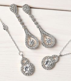 Bridal Accessories, Silver Jewelry, Teardrop Earrings, Jewelry Earrings, Dainty Earrings, Cubic Zirconia Earrings ► Spend $200 | Receive 10% OFF Your Order with Code: 10OFF200 ► Please note in your order when your wedding date is Classic linear 18K white gold earrings decorated in cubic zirconia pave crystals. Complete the look with a side-swept bun for an angelic yet sultry look. MATERIALS & MEASUREMENTS - 18K White Gold or Gold over Brass - Cubic Zirconia Pave Crystals - Hypoallergenic, le Elegant Jewelry Sets With Matching Dangle Earrings, Anniversary Jewelry Sets With Drop Earrings, Cubic Zirconia Jewelry Sets With Dangle Earrings, Formal Drop Jewelry Sets With Matching Earrings, Unique Wedding Earrings, Silver Bridal Earrings, Side Swept, Accessories Silver, Back Necklace