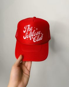 Red is having it's moment this year and we can all use the reminder to take care of ourselves and fill our cup. This is one of the best fitting trucker hats I've ever tried! Trucker hats are the perfect pop of color and style to add to your basic spring and summer outfits. Comfortable unisex fit; one size. Crown: 22.8 Fun Red Snapback Trucker Hat, Red Letter Print Snapback Trucker Hat, Trendy Red Trucker Hat With Letter Print, Fun Red Trucker Hat With Letter Print, Trendy Red 5-panel Hat, Red Trucker Hat With Letter Print And Curved Brim, Red 5-panel Hat With Letter Print, Red Letter Print 5-panel Hat, Spring And Summer Outfits