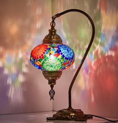 a colorful lamp sitting on top of a table