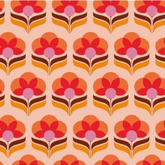 an orange and red flower pattern on a pink background