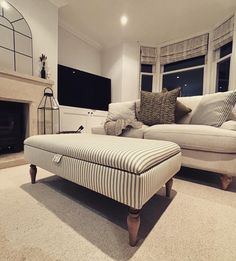 a living room filled with furniture and a fire place