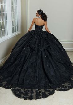 We are obsessing over this all black Quinceanera that just screams uniqueness! 89482, is a stunning ballgown with a blingy corset bodice that will accentuate your waistline and have you sparkling all night long. The delicate lace details that flow onto the sparkling tulle skirt that's completed with a petal train and lets not forget about the mesmerizing bow on the back! This is perfect for your Quince day! For additional details on this ballgown, give us a call at Terry Costa or chat with us! Quinceanera Dresses Blue And Black, Black Sparkly Ball Gown, Sweet 16 Black Dresses, Black Sparkly Wedding Dress, Black Red And Gold Quinceanera, Black 15 Dress, Black Dress Quince, 15 Dresses Quinceanera Black, Black Xv Dresses